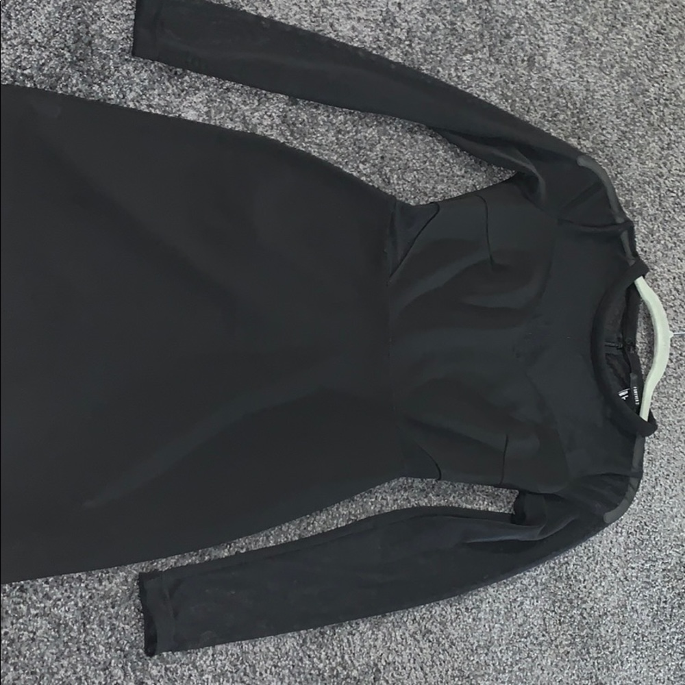 Black dress with mesh cut outs on sleeve and belly